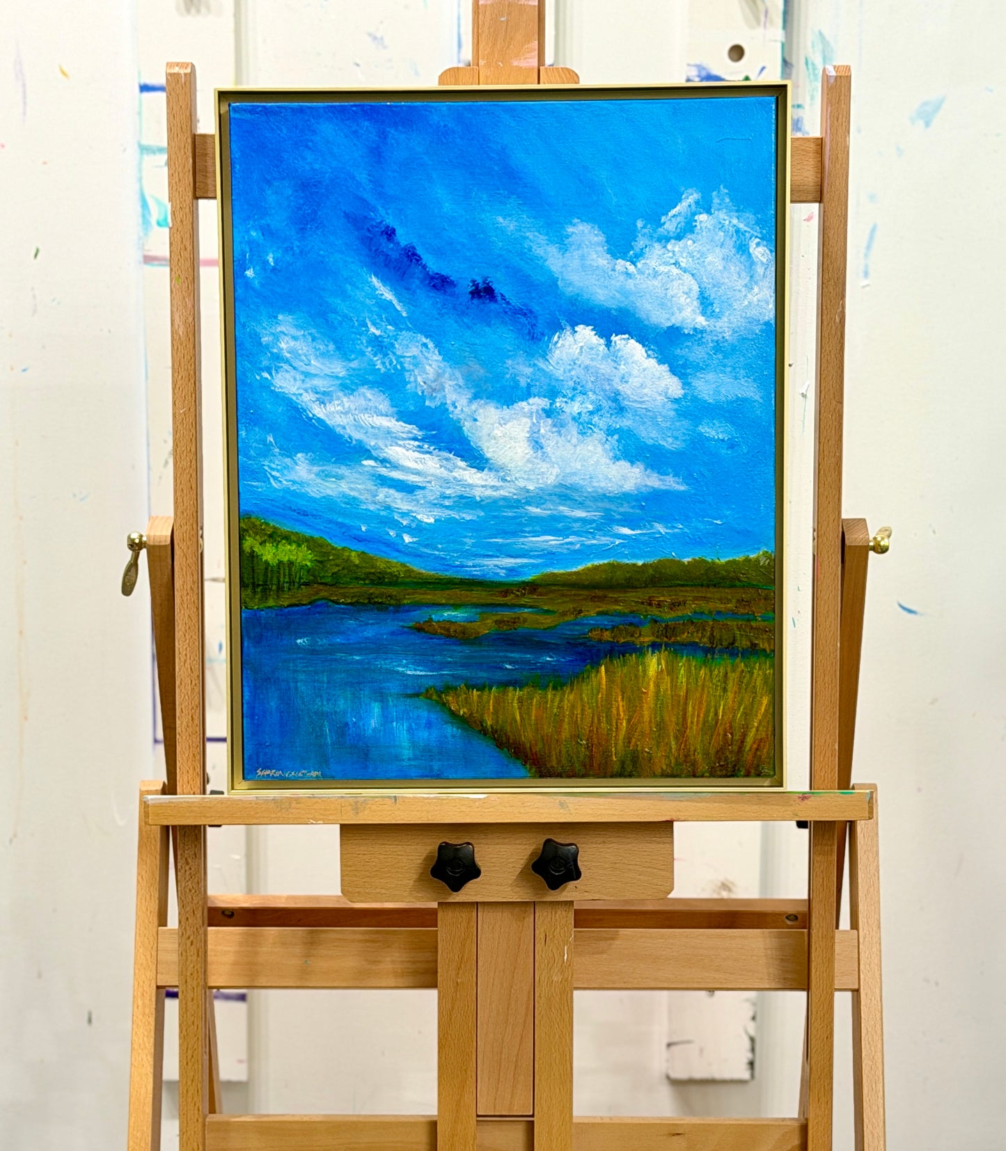 Lowcountry Autumn original acrylic landscape painting displayed on an artist's easel.