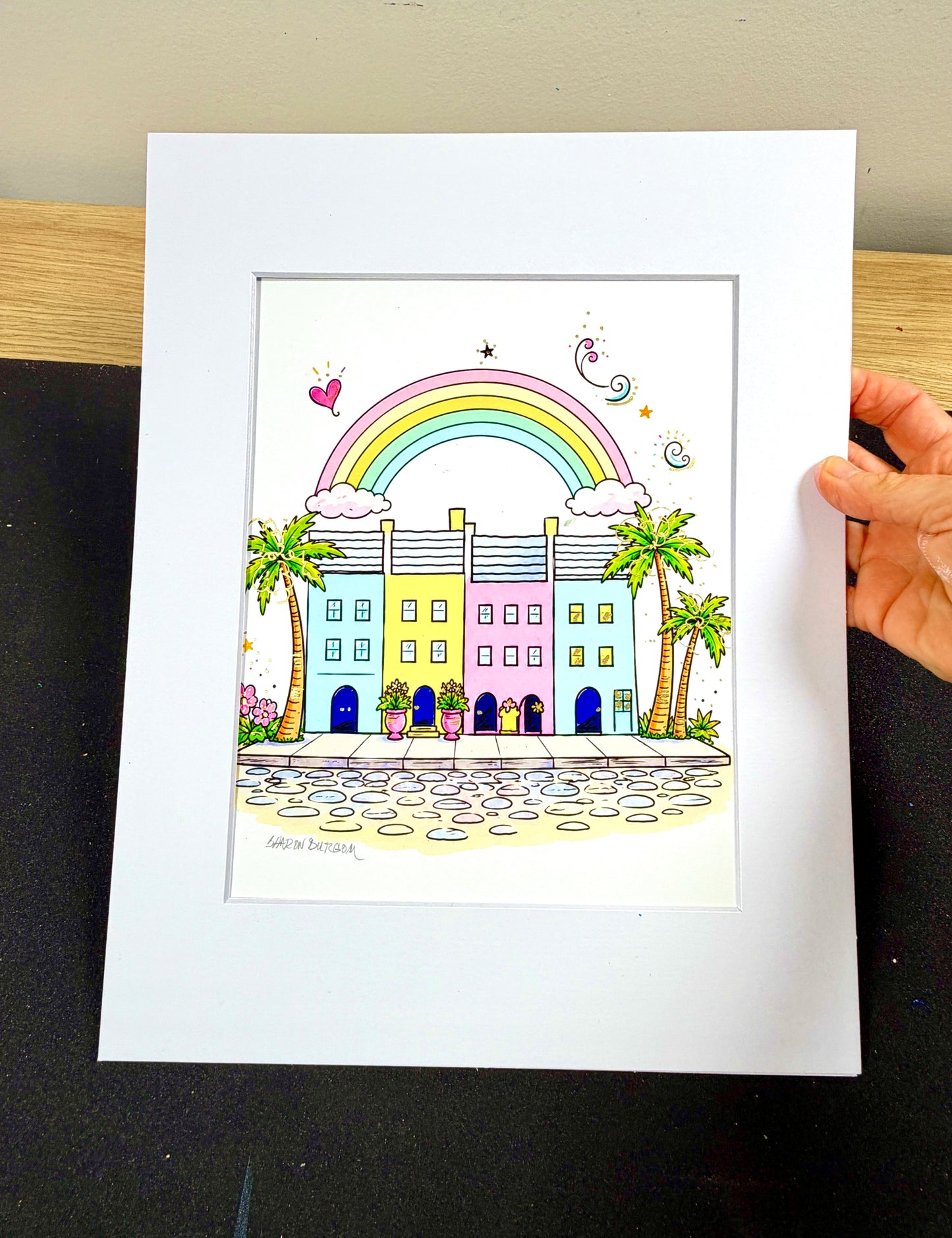 Framed Rainbow Row artist embellished print displayed in a white mat.