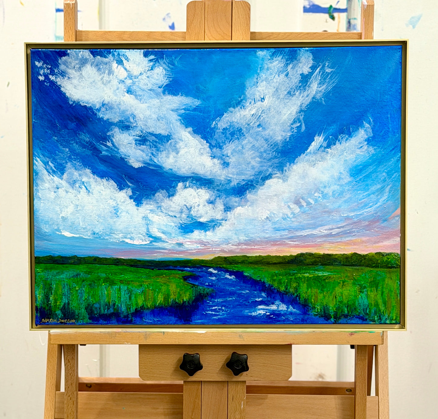 Storm Over the Stone original acrylic landscape painting displayed on an artist's easel.