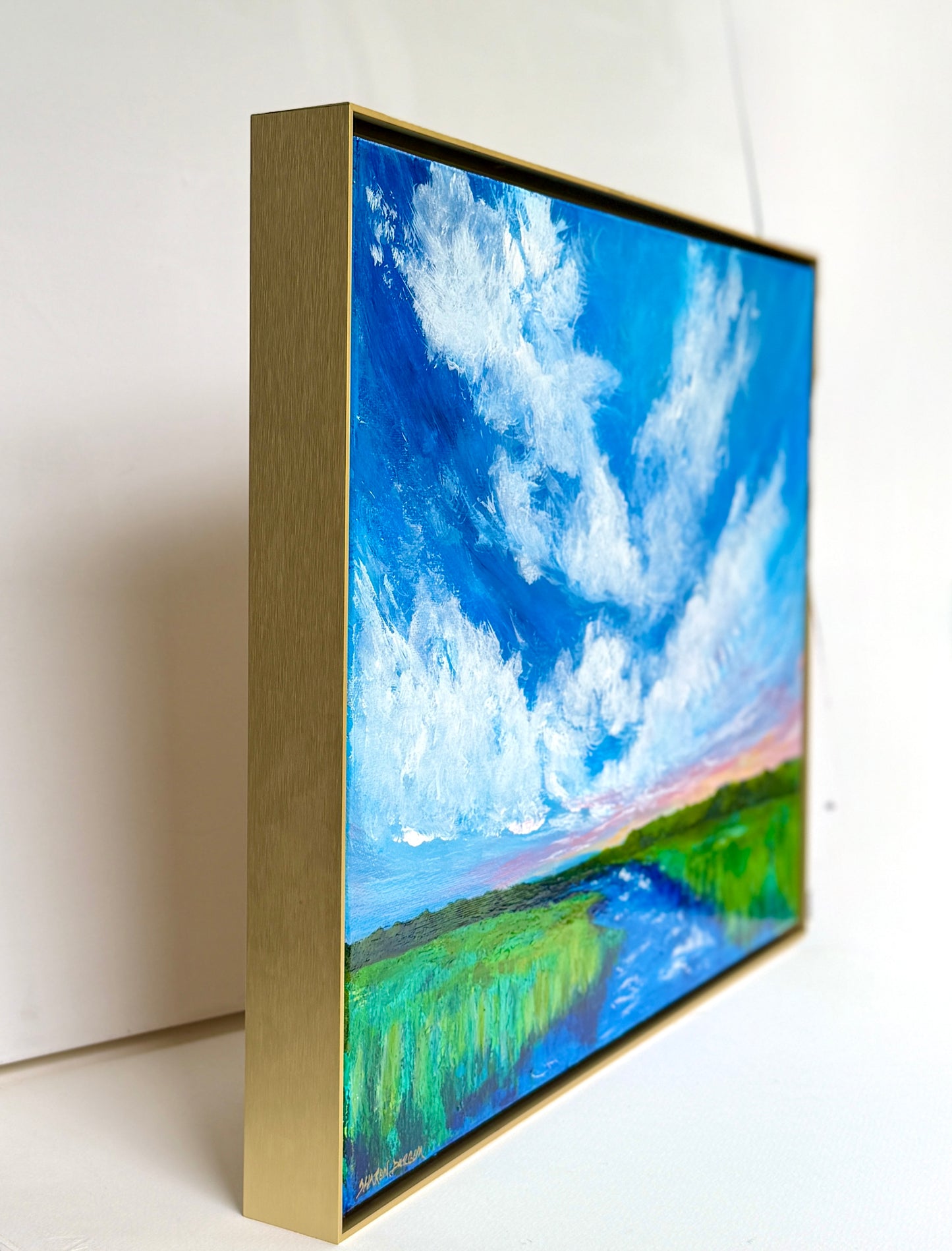 Side view of Storm Over the Stone showing the gallery-wrapped canvas and gold floater frame.