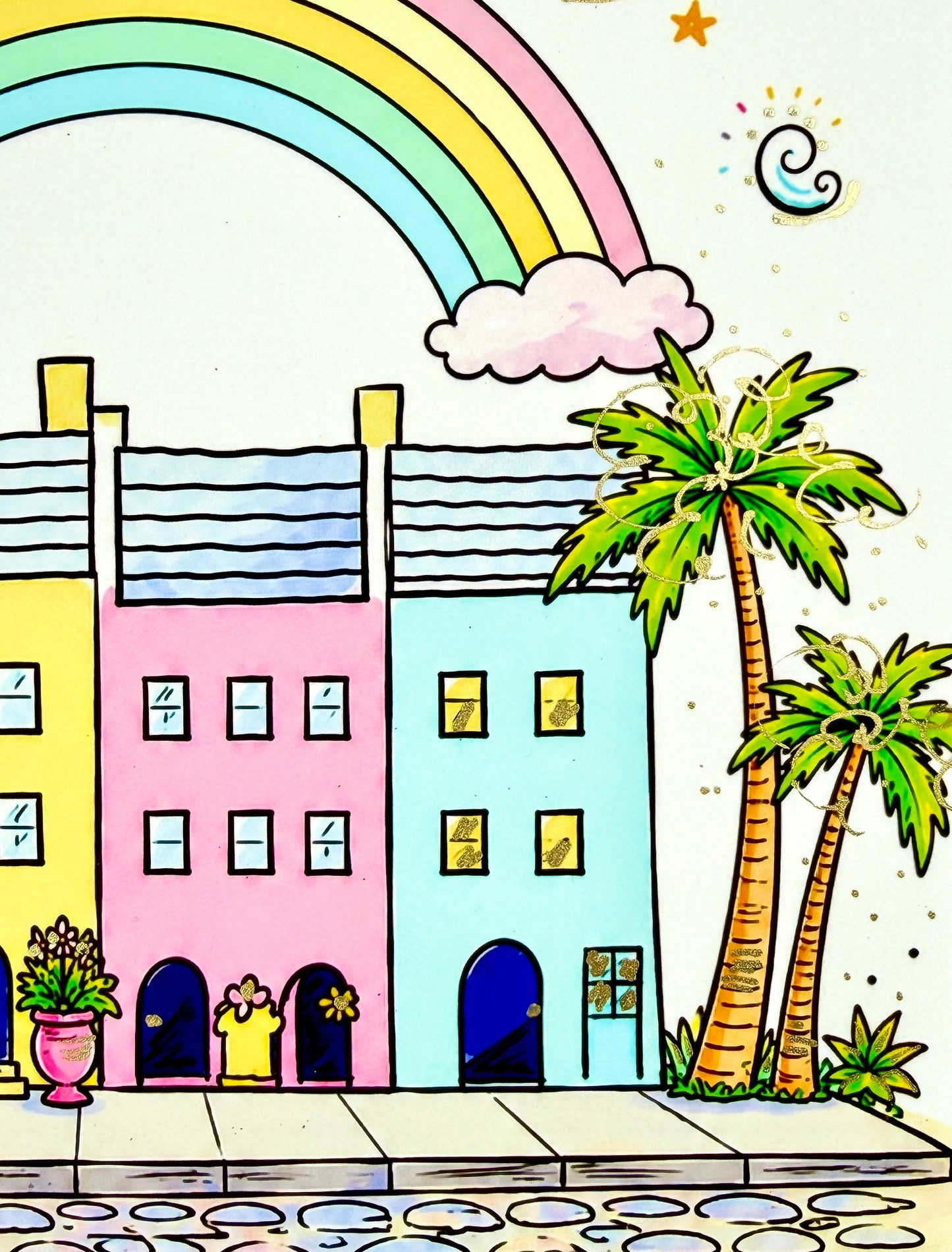 Close-up of Rainbow Row homes with hand-painted metallic gold embellishments.